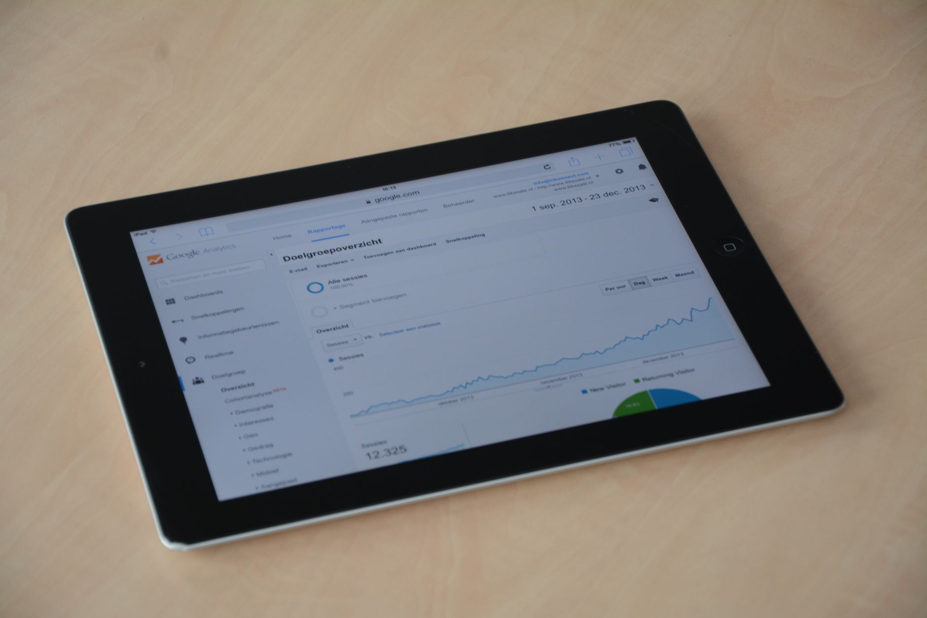Tablet displaying a web analytics dashboard with performance graphs, representing Google Search Console tracking