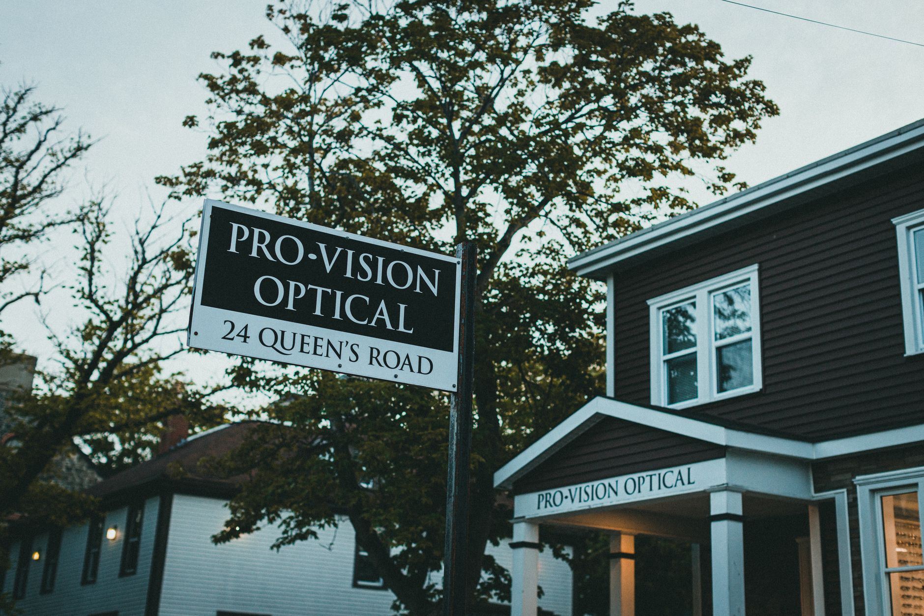 Street-level view of a local business sign and storefront representing local service pages and area targeting