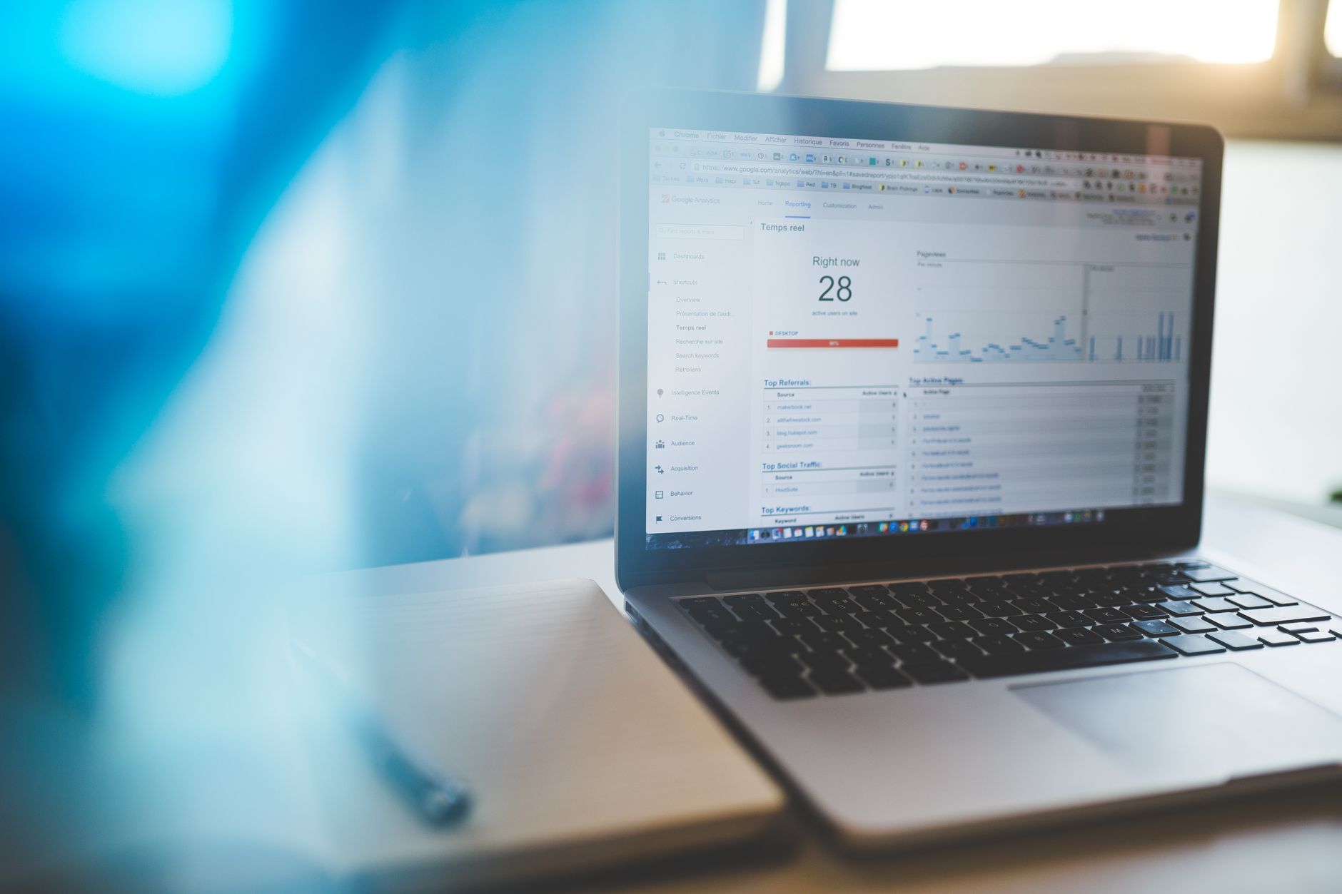 Laptop displaying Google Analytics dashboard in a modern workspace representing WordPress SEO setup and performance tracking