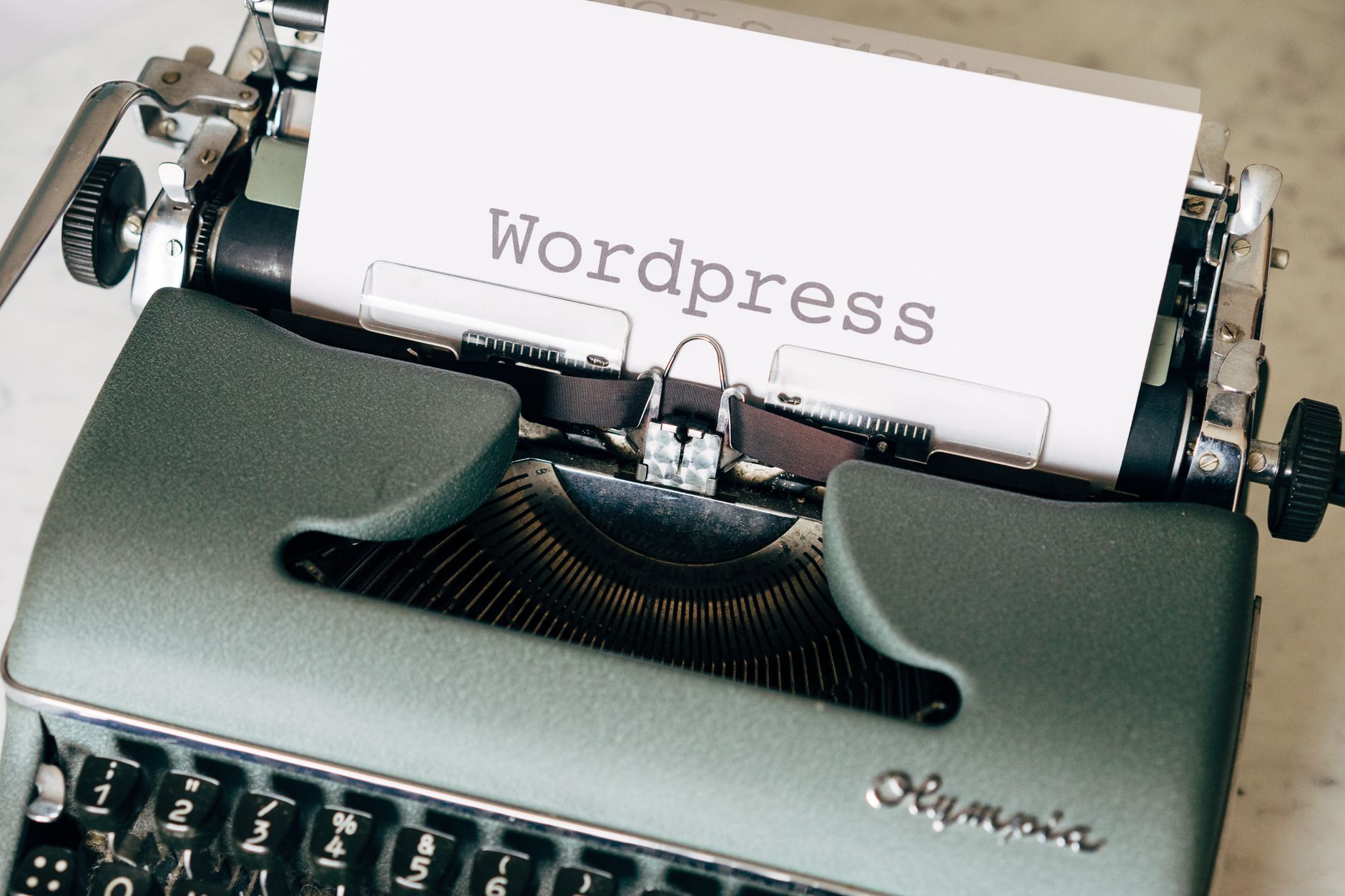 Vintage typewriter with paper reading WordPress, representing the foundations of WordPress content and SEO