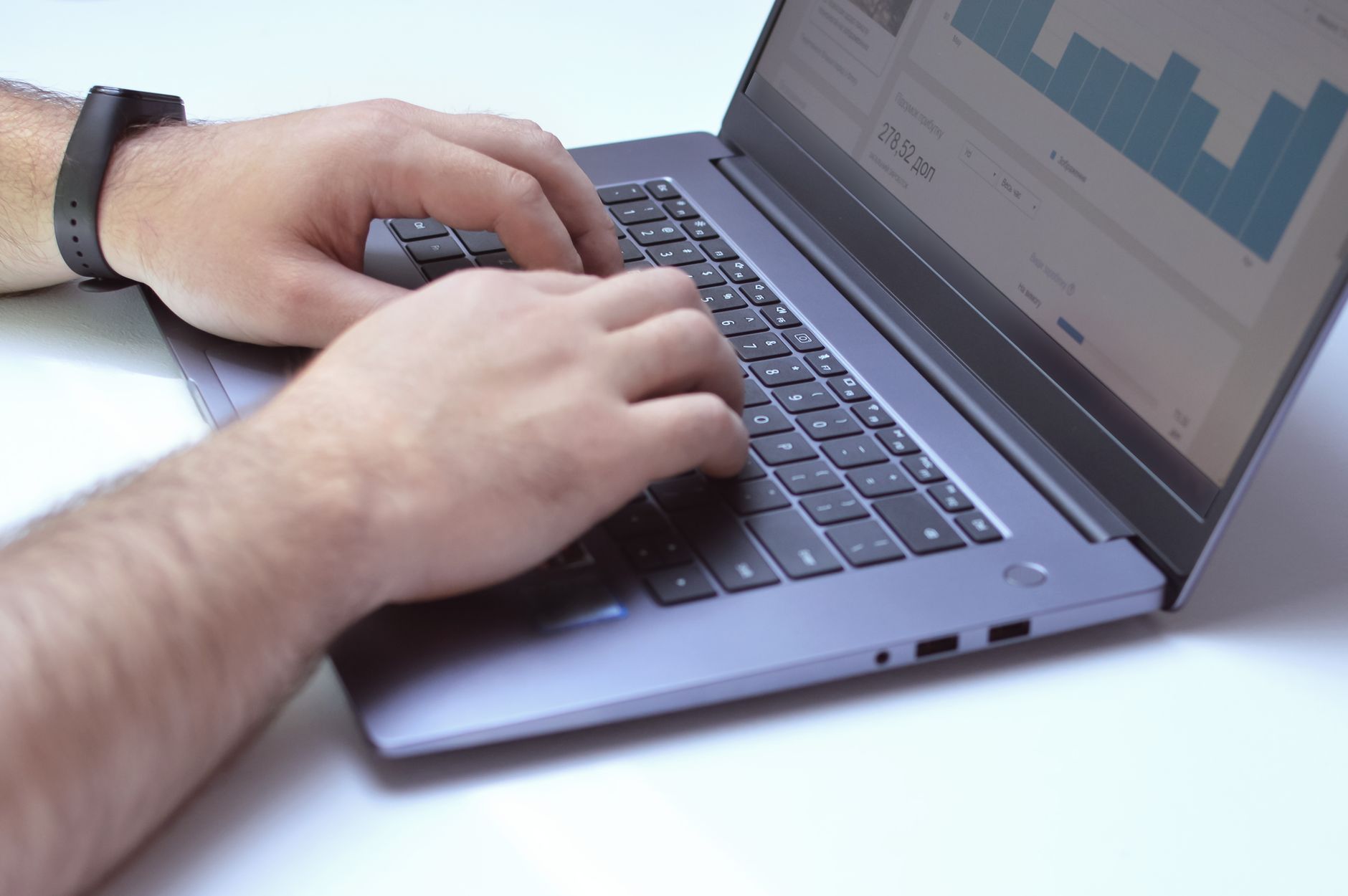 Business owner reviewing SEO analytics on a laptop to improve local search visibility