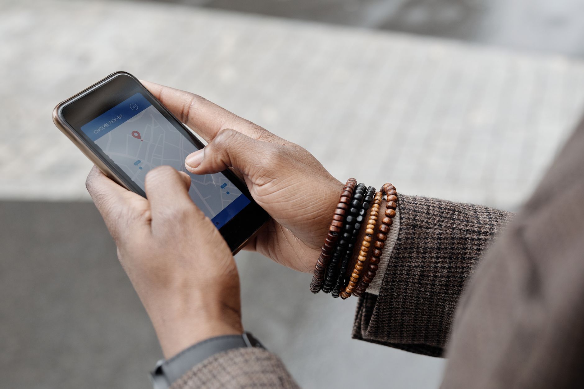 Close-up of hands navigating a GPS map app on a smartphone — illustrating Google Business Profile and local search