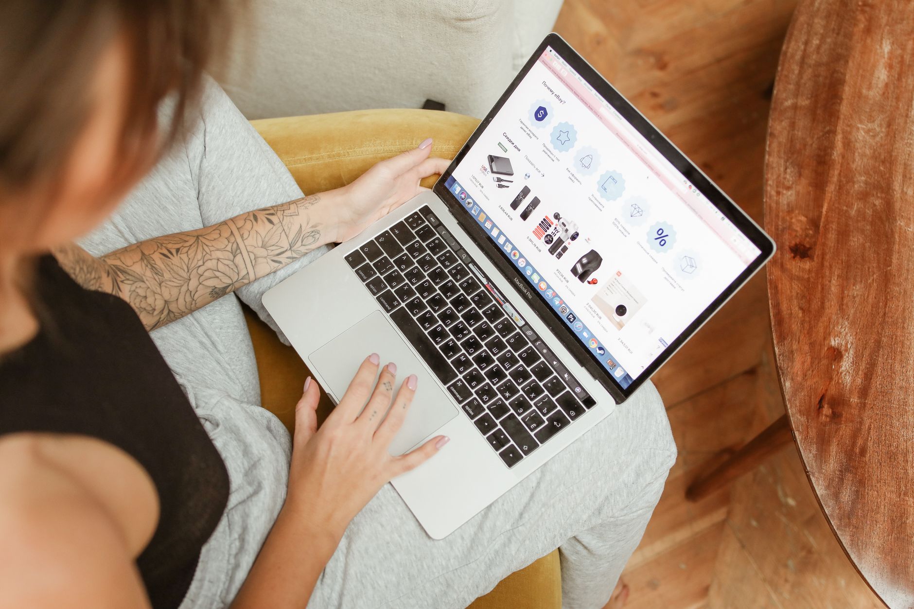 Woman browsing an ecommerce store product category on a laptop