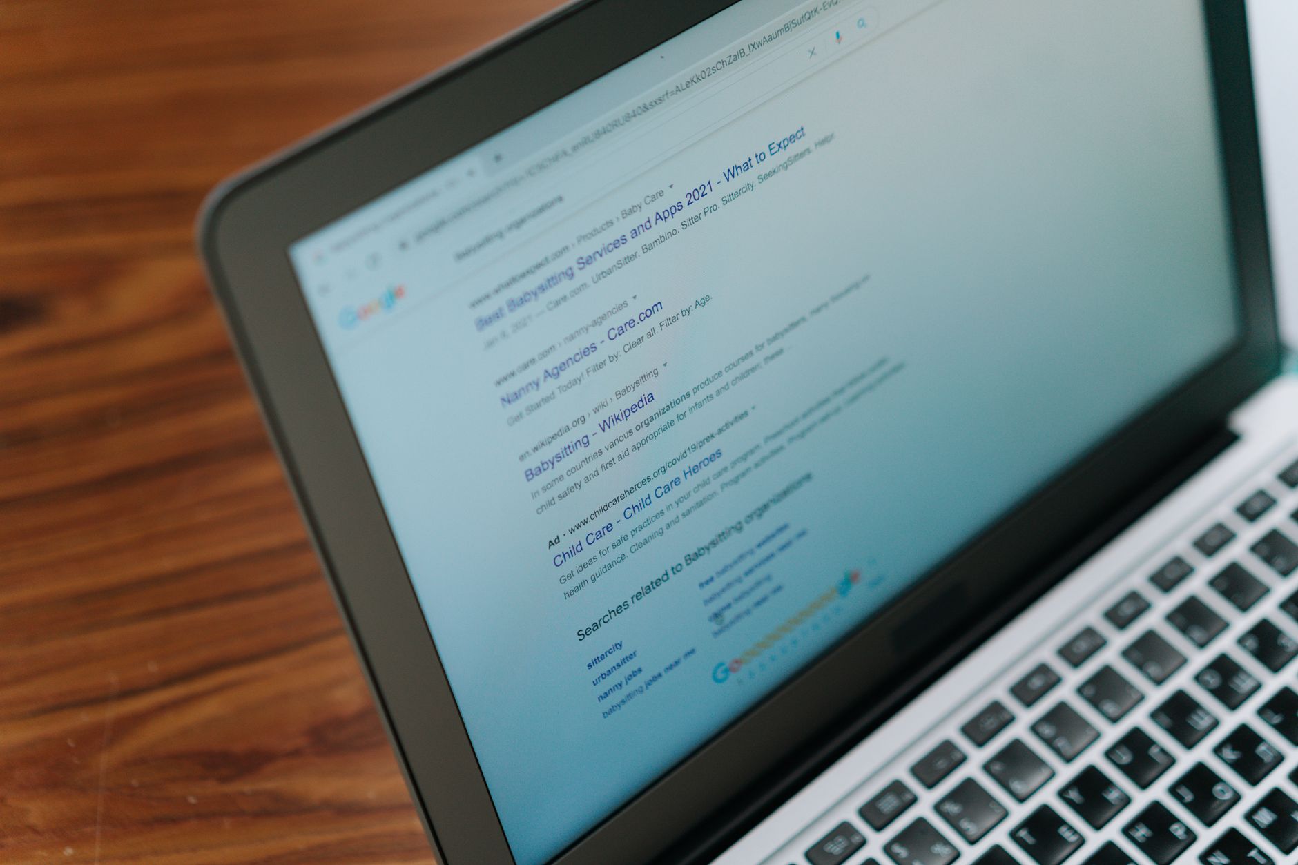 Laptop screen displaying Google search results, representing WordPress SEO and Google rankings