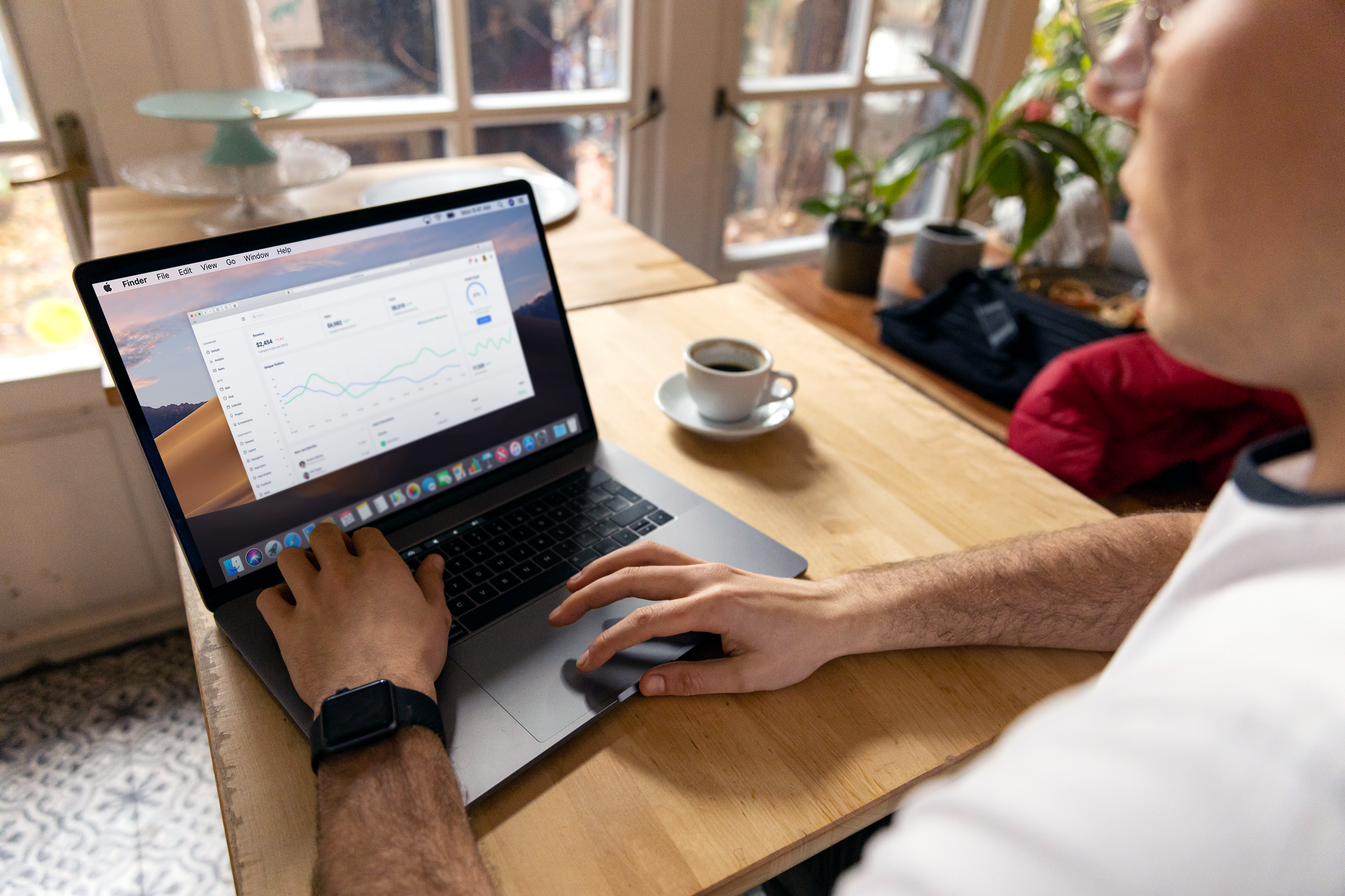 Person reviewing website analytics data on a laptop, representing regular Google Search Console performance reviews for WordPress SEO