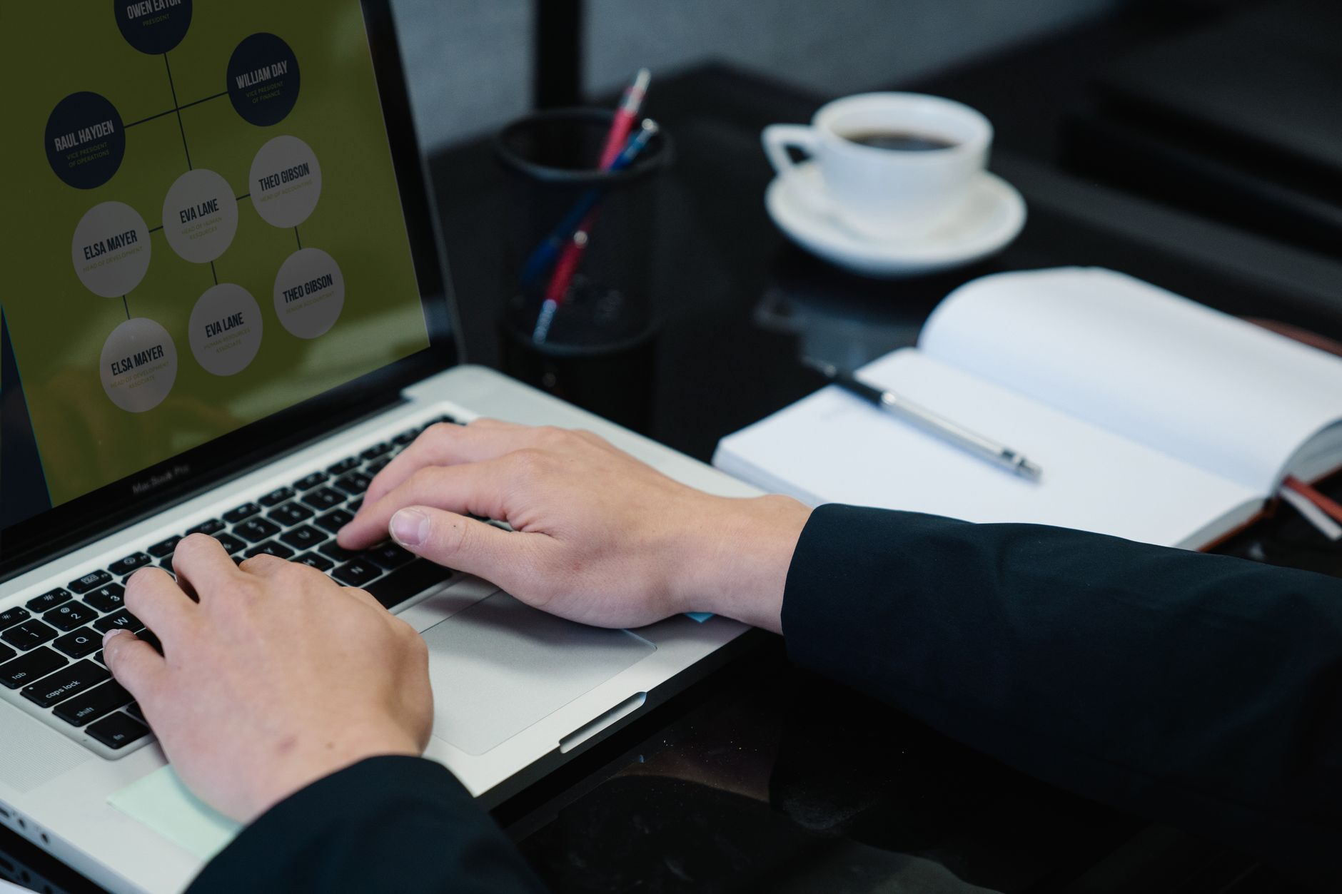 Hands typing on a laptop displaying a site structure diagram — planning internal links for WordPress SEO