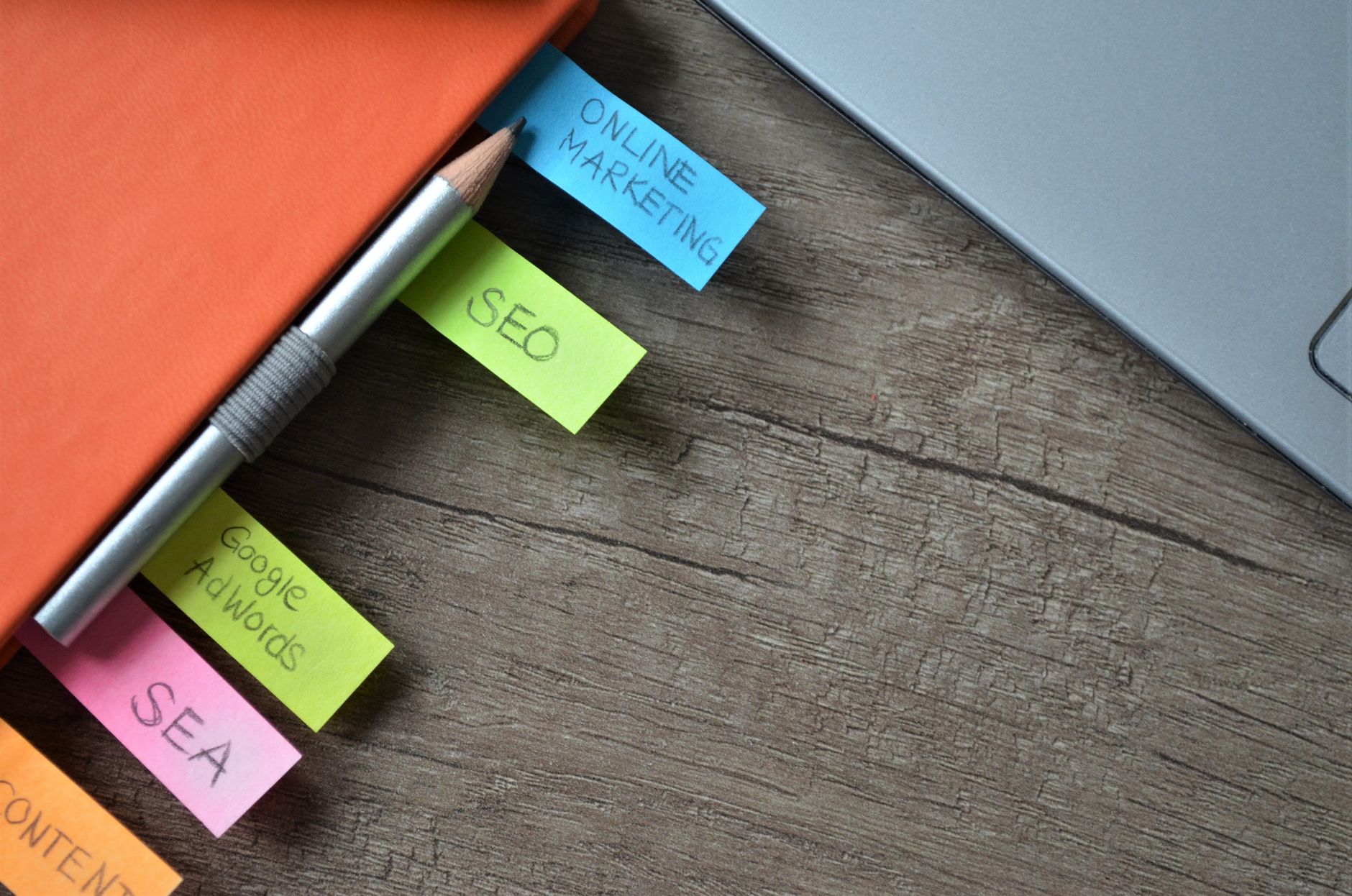 SEO strategy planner with colorful sticky notes and pencil on a notebook representing WordPress SEO checklist planning