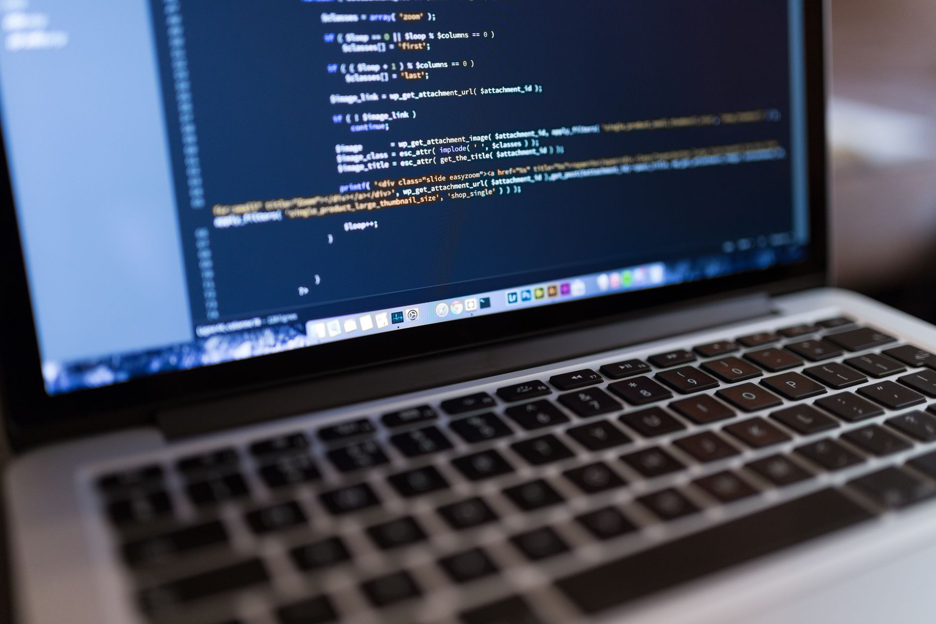 WordPress code displayed on a laptop screen representing website performance and template optimization