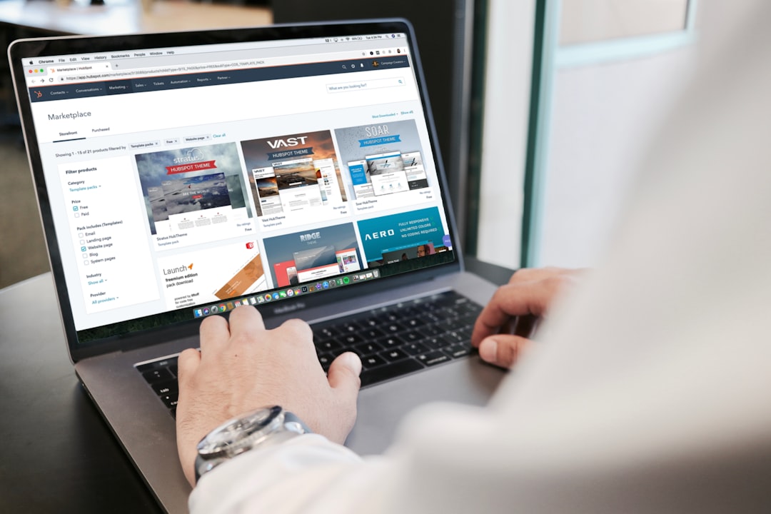 Person browsing a website marketplace on a MacBook Pro — illustrating how internal links guide users through a well-structured site