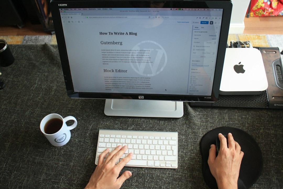 Person writing content in the WordPress Gutenberg block editor on a desktop computer