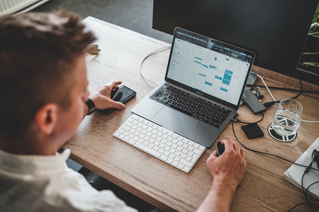 Person reviewing web analytics data on a laptop to assess Google Analytics 4 traffic quality for SEO