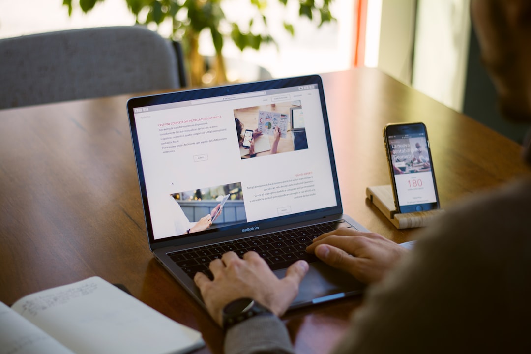 Person working on a laptop browsing a website, representing internal linking and site navigation for WordPress SEO