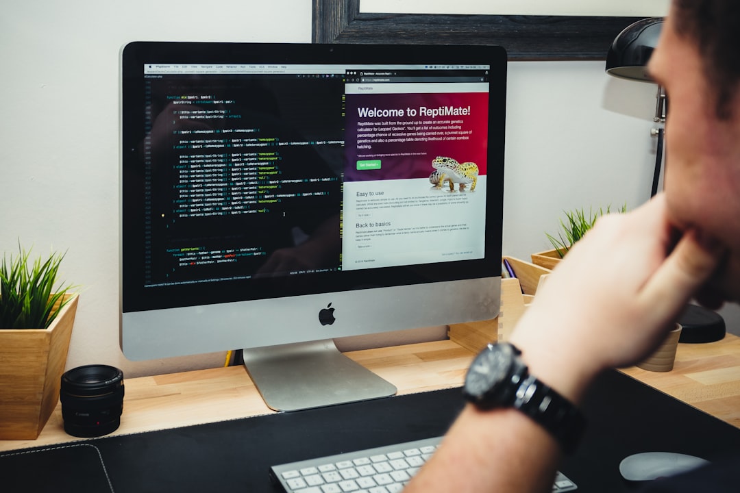 Web developer reviewing a WordPress site and code editor on an iMac desktop — WordPress SEO pre-launch checklist. Photo by Fotis Fotopoulos on Unsplash.