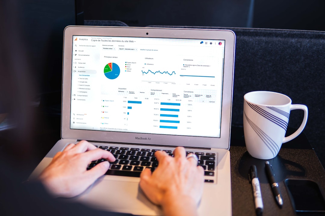 Google Analytics overview report on a laptop screen showing SEO performance metrics