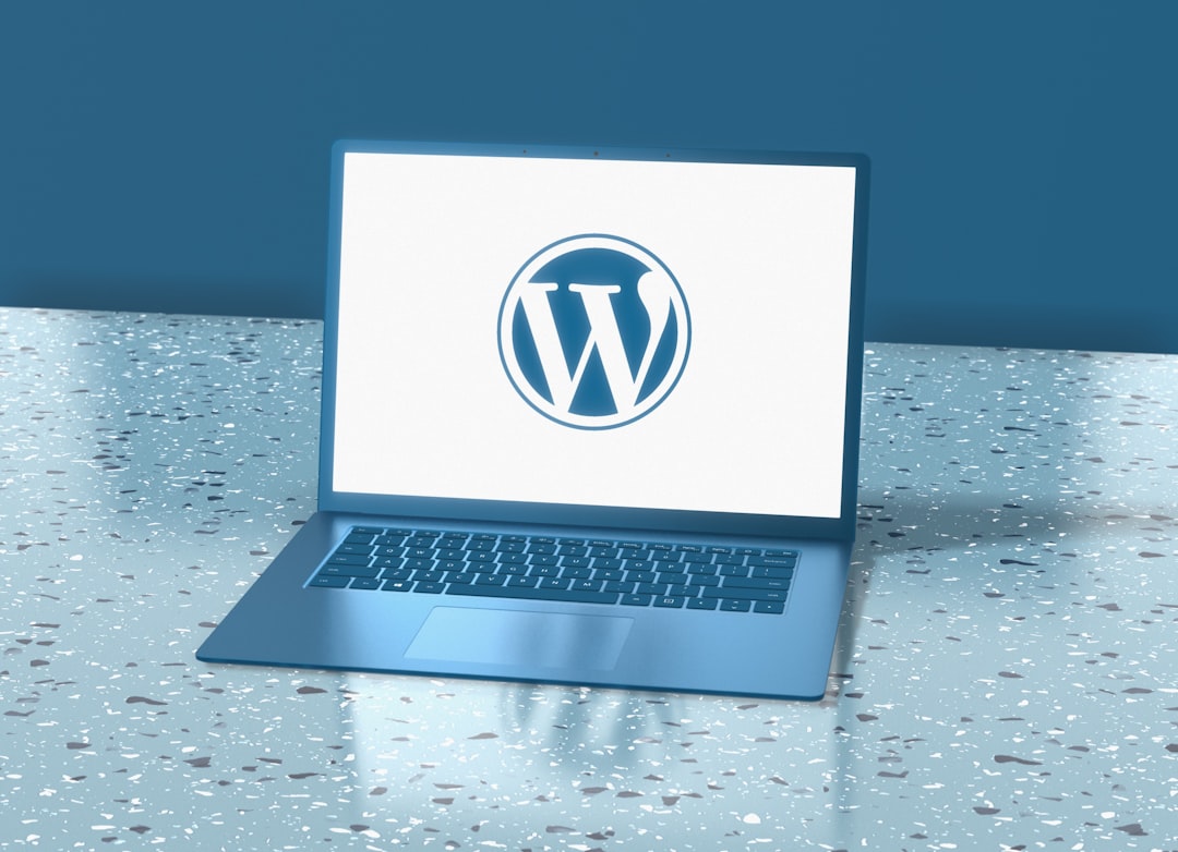 Blue laptop displaying the WordPress logo representing WordPress SEO tools and techniques