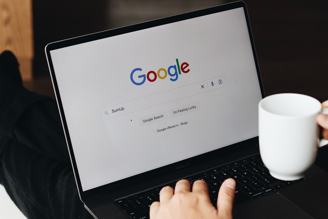 Person searching Google on a laptop — understanding what search engines look for is the foundation of WordPress SEO