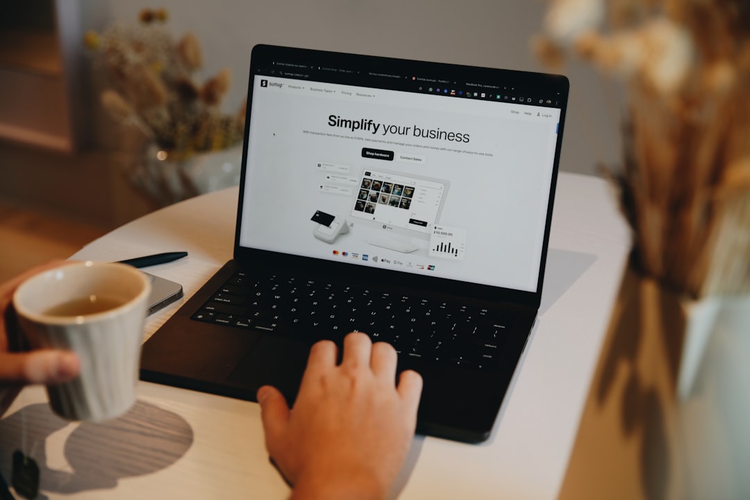Small business owner working on a laptop with a website strategy dashboard — WordPress SEO setup